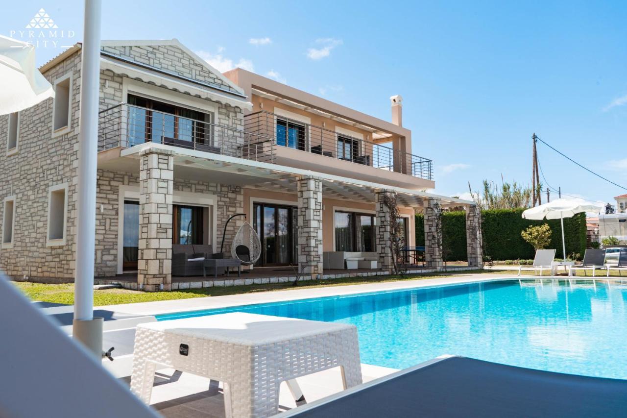 Luxury Villa Hera - Beachfront Roda  Exterior photo